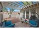 Back patio with brick flooring, hanging patio chair, and shade-providing latticework at 20627 W Grandview Dr, Buckeye, AZ 85396
