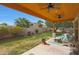 Under the covered patio are ceiling fans and a comfortable outdoor living space at 20627 W Grandview Dr, Buckeye, AZ 85396