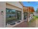 The house boasts a backyard with a covered patio, sliding glass doors, and landscaping at 20627 W Grandview Dr, Buckeye, AZ 85396
