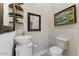 Stylish half-bathroom featuring modern fixtures, unique sink, and charming decor at 20627 W Grandview Dr, Buckeye, AZ 85396