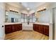 Bright bathroom features dual sinks, soaking tub and a large window at 20627 W Grandview Dr, Buckeye, AZ 85396