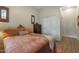 Comfortable bedroom featuring stylish decor and wood flooring with a closet to the right at 20627 W Grandview Dr, Buckeye, AZ 85396