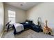 Cozy bedroom with carpet floors, a telescope, and musical instruments at 20627 W Grandview Dr, Buckeye, AZ 85396