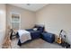 Comfortable bedroom with ample natural light, plush carpet, and a cozy feel at 20627 W Grandview Dr, Buckeye, AZ 85396