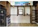 This walk-in closet features custom built-in wood shelving and wood floors at 20627 W Grandview Dr, Buckeye, AZ 85396