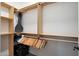 Walk-in closet with built-in shelving for clothes storage and organization at 20627 W Grandview Dr, Buckeye, AZ 85396
