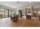 Bright dining area with hardwood floors, neutral decor, and large windows, offering a welcoming space for meals and entertaining at 20627 W Grandview Dr, Buckeye, AZ 85396