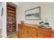 Dining area featuring custom cabinetry, vintage sideboard, and decorative art at 20627 W Grandview Dr, Buckeye, AZ 85396