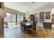 Elegant dining room with wood floors, large windows, and stylish furnishings at 20627 W Grandview Dr, Buckeye, AZ 85396