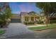 Charming home featuring a welcoming front porch, stone accents, and manicured landscaping at 20627 W Grandview Dr, Buckeye, AZ 85396