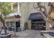Urban bistro with outdoor seating, a modern awning, and a stylish sidewalk at 20627 W Grandview Dr, Buckeye, AZ 85396