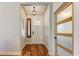 Entryway with high ceilings, hardwood flooring, and modern lighting fixture at 20627 W Grandview Dr, Buckeye, AZ 85396