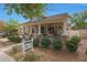 Charming single Gathering home featuring a welcoming porch and well manicured landscaping at 20627 W Grandview Dr, Buckeye, AZ 85396