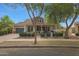 Attractive property featuring a covered front porch and a two-car garage with driveway at 20627 W Grandview Dr, Buckeye, AZ 85396
