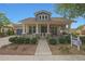 Inviting single-story home with a covered porch, stone accents, and manicured landscaping at 20627 W Grandview Dr, Buckeye, AZ 85396
