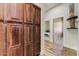 Hallway featuring tall cabinets for storage, with a view into another room at 20627 W Grandview Dr, Buckeye, AZ 85396