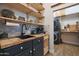 Pantry/Laundry room with custom natural wood shelves and countertops at 20627 W Grandview Dr, Buckeye, AZ 85396
