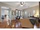 Inviting living room with hardwood floors, ceiling fan, and natural light, offering a cozy and stylish space at 20627 W Grandview Dr, Buckeye, AZ 85396