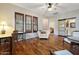Comfortable living area with hardwood floors, neutral tones, and large windows, creating a bright and airy ambiance at 20627 W Grandview Dr, Buckeye, AZ 85396