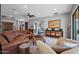 Bright living room with cozy seating, stylish decor, and seamless indoor-outdoor flow at 20627 W Grandview Dr, Buckeye, AZ 85396