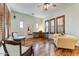 Well-lit living area featuring hardwood floors, natural light, and comfortable seating at 20627 W Grandview Dr, Buckeye, AZ 85396
