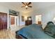 Spacious main bedroom features wood floors, ceiling fan and ensuite bathroom access at 20627 W Grandview Dr, Buckeye, AZ 85396