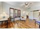 Bright and airy home office with hardwood floors, ample natural light, and a workspace at 20627 W Grandview Dr, Buckeye, AZ 85396