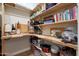 Walk-in pantry with natural wood shelving at 20627 W Grandview Dr, Buckeye, AZ 85396