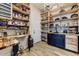 Spacious pantry features wood countertops, custom shelving, and ample storage space at 20627 W Grandview Dr, Buckeye, AZ 85396