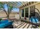 Relaxing outdoor patio with a hanging chair, pavers, and a pergola, perfect for entertaining at 20627 W Grandview Dr, Buckeye, AZ 85396