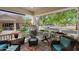 Charming covered porch with comfortable seating, cushions, a rug, and neighborhood views at 20627 W Grandview Dr, Buckeye, AZ 85396