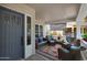 Inviting covered front porch with comfortable seating, a rug, and stylish decor at 20627 W Grandview Dr, Buckeye, AZ 85396
