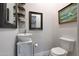 Elegant powder room with modern sink, stylish mirror, and fresh decor, a convenient and refined space at 20627 W Grandview Dr, Buckeye, AZ 85396