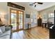 Bright room featuring french doors, multiple windows and a cozy sitting area at 20627 W Grandview Dr, Buckeye, AZ 85396