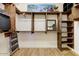 Spacious walk-in closet with custom wood shelving, drawers and ladder at 20627 W Grandview Dr, Buckeye, AZ 85396