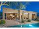 A relaxing backyard with a pool, outdoor seating, and a covered patio for entertaining and enjoying the desert scenery at 23014 N 52Nd St, Phoenix, AZ 85054