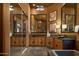 Elegant bathroom showcasing granite counters, dual sinks, framed mirrors, and natural wood cabinets at 23014 N 52Nd St, Phoenix, AZ 85054