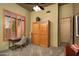 Comfortable bedroom with a murphy bed, desk, and window with stylish shutters for natural light at 23014 N 52Nd St, Phoenix, AZ 85054