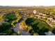 Scenic aerial view of a golf course community showcasing lush greens and well-maintained homes, ideal for a luxurious lifestyle at 23014 N 52Nd St, Phoenix, AZ 85054