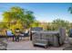 Patio featuring a hot tub with a stone surround and a comfortable seating area at 23014 N 52Nd St, Phoenix, AZ 85054