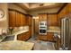Modern kitchen with stainless appliances, granite countertops, and lots of cabinets and storage at 23014 N 52Nd St, Phoenix, AZ 85054