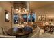 Cozy living area with plush seating, modern lighting, and views of the outdoor landscape at 23014 N 52Nd St, Phoenix, AZ 85054