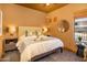Inviting main bedroom featuring a king-size bed, and decorative lamps for a comfortable retreat at 23014 N 52Nd St, Phoenix, AZ 85054