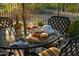 Close up of patio table with charcuterie board, wine, golf accessories and golf ball umbrella topper at 23014 N 52Nd St, Phoenix, AZ 85054