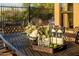 Close-up of outdoor table with drinks and succulents with patio and fence in background at 23014 N 52Nd St, Phoenix, AZ 85054
