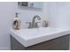 Close up on sink featuring white countertop and gray cabinet at 2305 E Southern Ave, Phoenix, AZ 85040