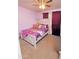 Bedroom featuring light purple walls and a ceiling fan, making it a cheerful retreat for rest and relaxation at 2305 E Southern Ave, Phoenix, AZ 85040