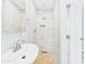 Bright bathroom featuring a modern sink and a shower with elegant marble tiling at 2628 W Marshall Ave, Phoenix, AZ 85017