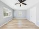 Cozy bedroom with new flooring, ceiling fan, and a bright window at 2628 W Marshall Ave, Phoenix, AZ 85017