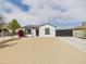 Charming single-story home with a fresh exterior, solar panels, desert landscaping, and a private driveway gate at 2628 W Marshall Ave, Phoenix, AZ 85017